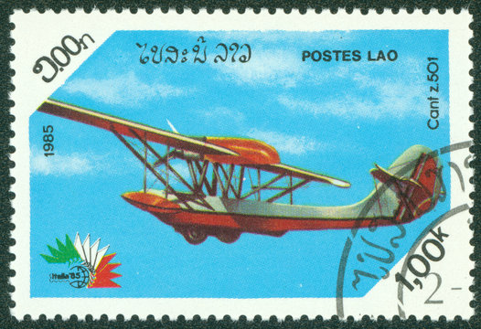 stamp printed in Laos showing Cant z.501 biplane