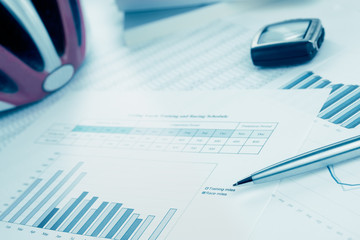 Training and race plan for cycling. Helmet, monitor. Blue toned.