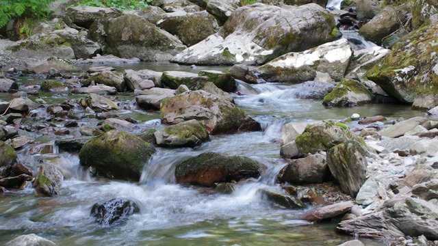 Beautiful mountain river flowing down through the rocks.
