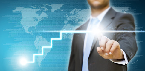 Businessman drawing a graph