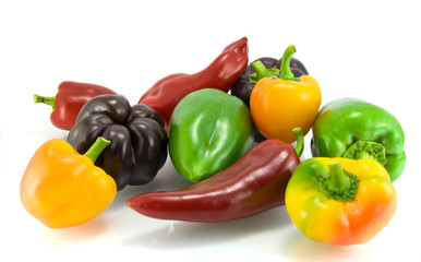 Red, green and yellow sweet pepper on a white background