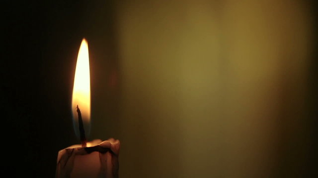 Candle lights up and being blown out slowly