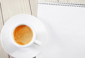 Coffee in the white cup and note