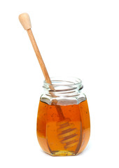 jar of honey with dipper