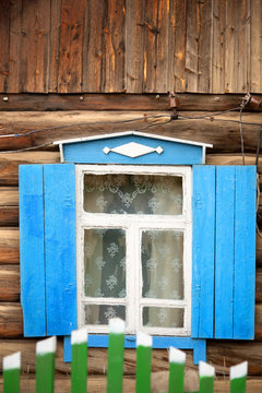 Typical wooden windows of a house on Lake Baikal in Russia