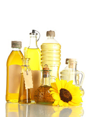 oil in jars and sunflower, isolated on white