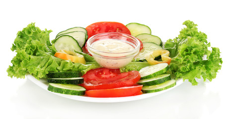 Chopped vegetables and sauce on plate isolated on white