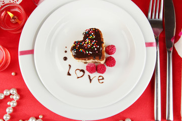 Plate with dessert in form of heart