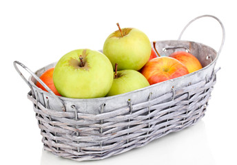 Ripe apples in basket isolated on white