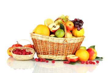 Assortment of exotic fruits in basket, isolated on white