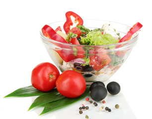 Fresh greek salad in glass bowl isolated on white