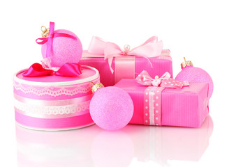 Colorful pink gifts with pink Christmas balls isolated on white