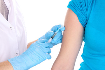 Fototapeta premium doctor holding syringe with vaccine into patient's shoulder