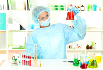 Young female scientist in  laboratory.