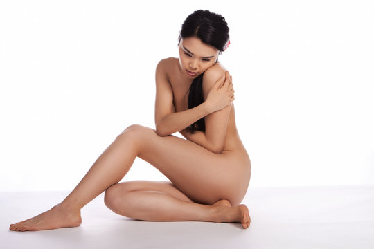 Beautiful Asian woman posing naked