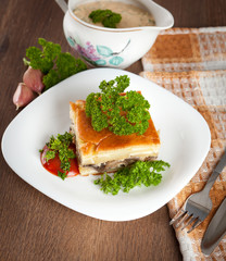 Casserole with mushrooms, meat and spices.