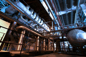 Fototapeta premium Industrial zone, Steel pipelines and cables in blue tones