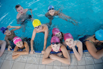 happy children group  at swimming pool
