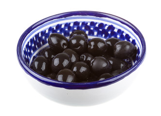 Olives black watered with olive oil in a bowl isolated on a whit