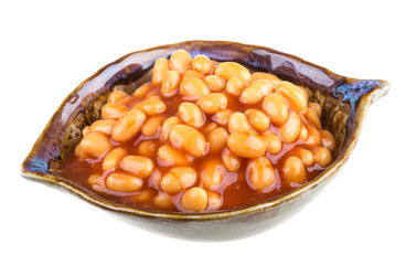 Marinated haricot beans in tomato sauce with shallots on a plate
