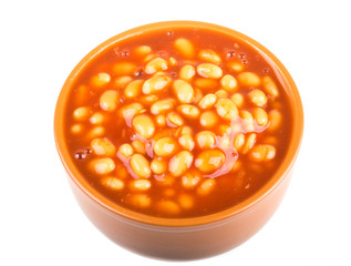 Marinated haricot beans in tomato sauce with shallots on a plate