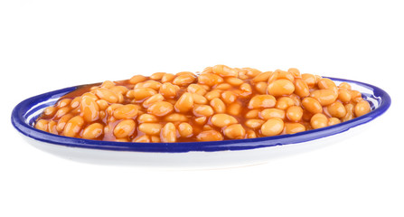 Marinated haricot beans in tomato sauce with shallots on a plate