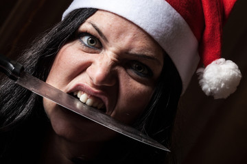 Bad Woman with Santa Hat and Knife - obrazy, fototapety, plakaty