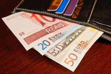 Brazilian real, euro and dollars in wallet