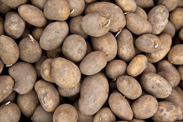 Fototapeta na wymiar Raw potatoes for sale on marketplace