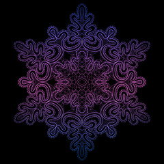 lacy snowflake on a black background