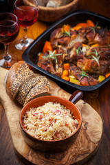 Sauerkraut with roasted pork belly on vegetables