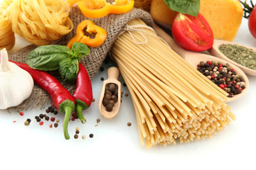 Pasta spaghetti, vegetables and spices, isolated on white