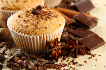 tasty muffin cakes with chocolate, spices and coffee seeds,