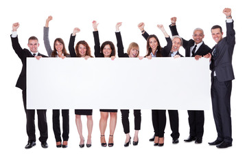 Group of business people with a blank banner