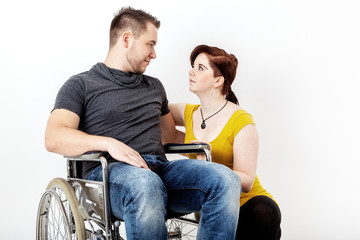 Man in wheelchair and his girlfriend is worried