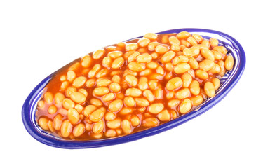 Marinated haricot beans in tomato sauce with shallots on a plate