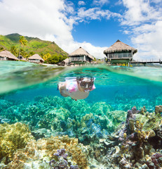 Woman snorkeling at coral reef