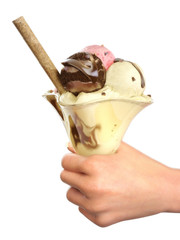 Hand holding chocolate,vanilla, strawberry ice cream Sundae.