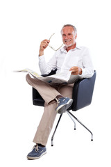 Casual senior man with newspaper
