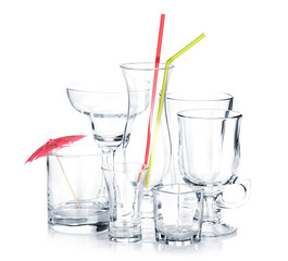 Cocktail glasses with drinking straws and umbrella