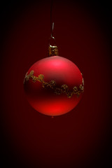 red christmas ball on dark background