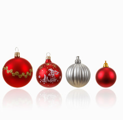 Collection of four Christmas balls on white