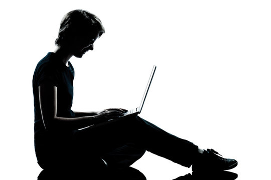 recommend clip art: one young teenager boy or girl silhouette computer computing lap