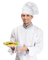 Portrait of chef cook showing salad dish, isolated on white