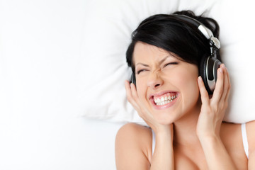 Fototapeta premium Woman in underwear listens to music