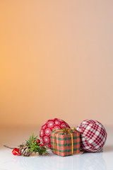 Gift in colorful wrapping with golden ribbons and christmas ball
