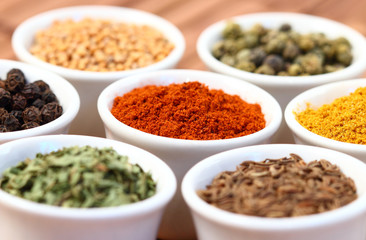 Colorful spices on white pots