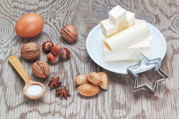 Ingredients for baking sweets for Christmas. On a wooden texture