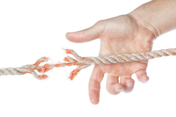 Man's hand catching torn end of the rope. On a white background.