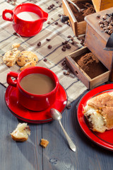 Coffee with milk served with a croissant for breakfast